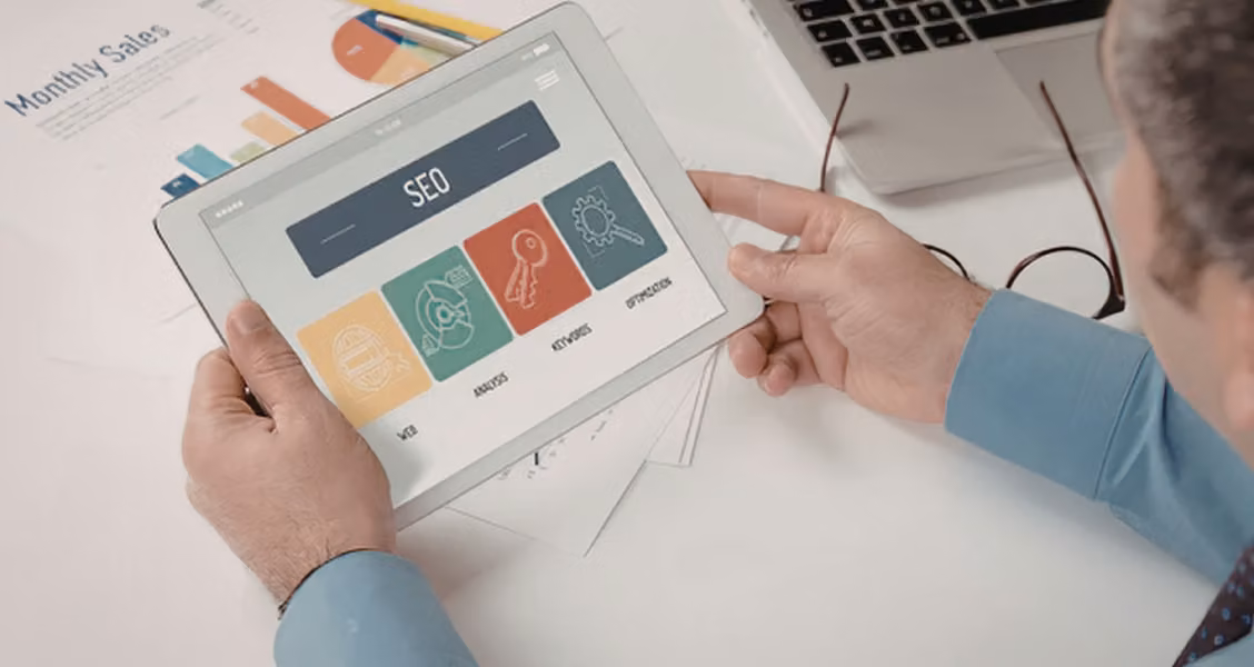 Marketer reviewing an account-based marketing campaign dashboard on a tablet