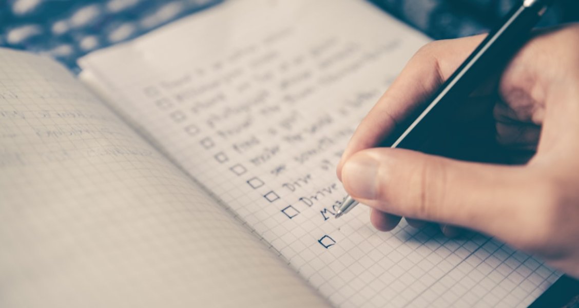Customer success manager reviewing a client onboarding checklist on a tablet