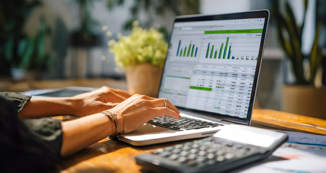 Account manager comparing client onboarding tools on a laptop with a client portal open