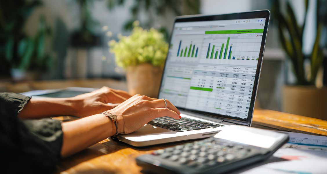 Account manager comparing client onboarding tools on a laptop with a client portal open