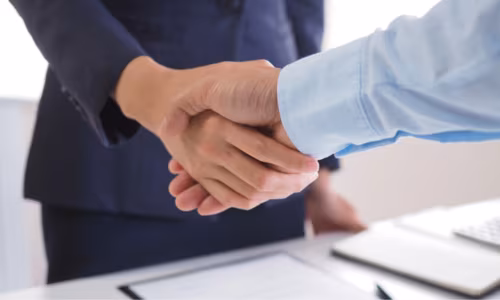 Two persons making deals