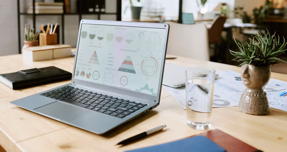 Professional reviewing a proposal's engagement analytics on a laptop