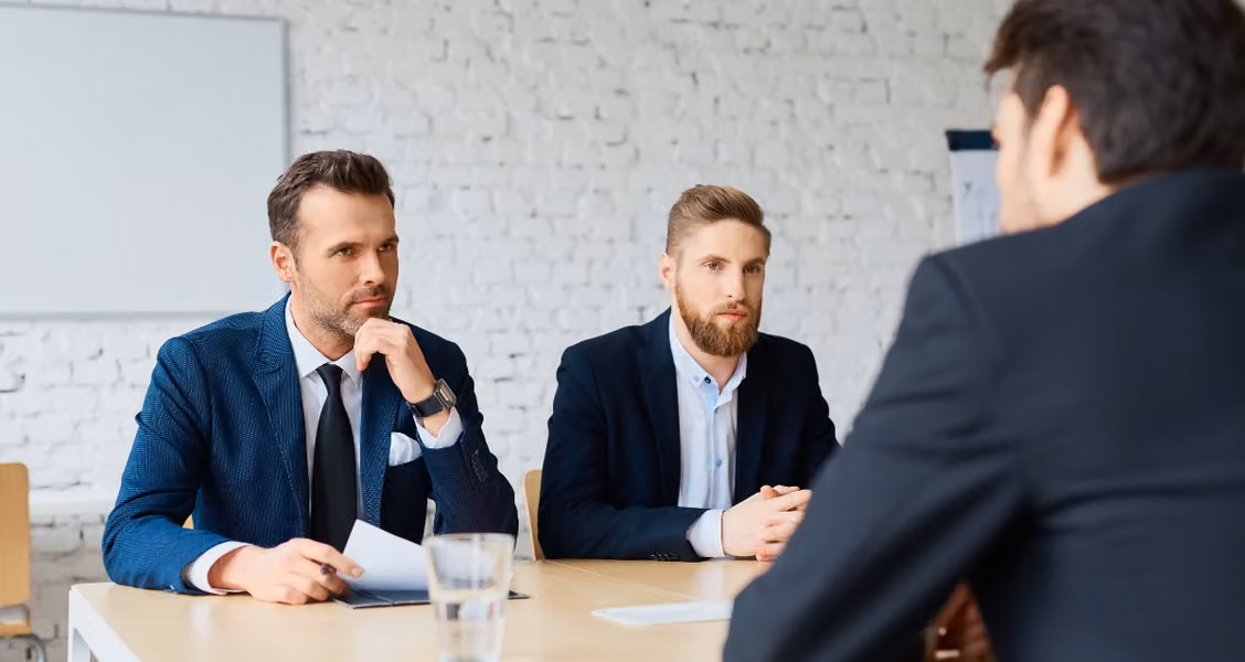 Hiring panel interviewing a candidate in a professional job interview