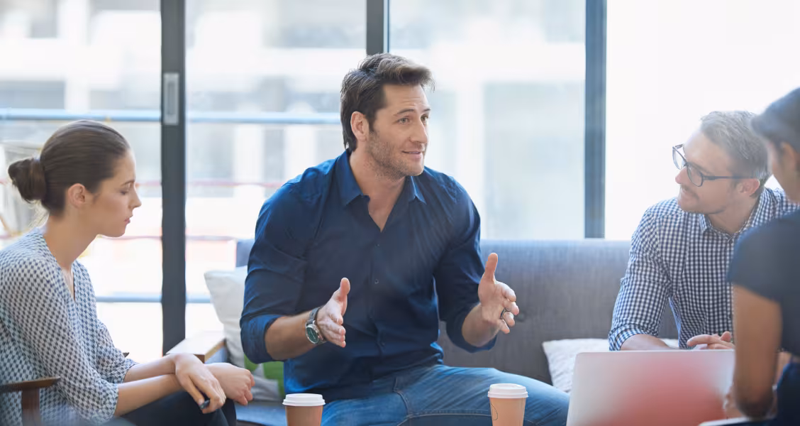 Sales rep delivering a pitch on a video call to a group of stakeholders