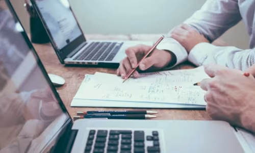 Sales rep tailoring a personalized proposal for a specific client to differentiate from competitors