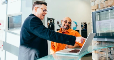 Two colleagues talking in an office