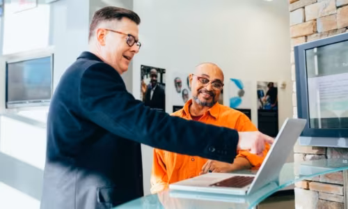 Two colleagues talking in an office
