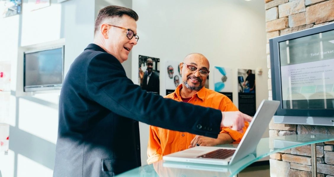 Two colleagues talking in an office