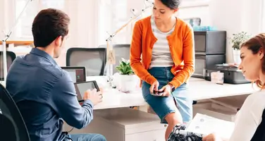 Office team analyzing data on a smartphone