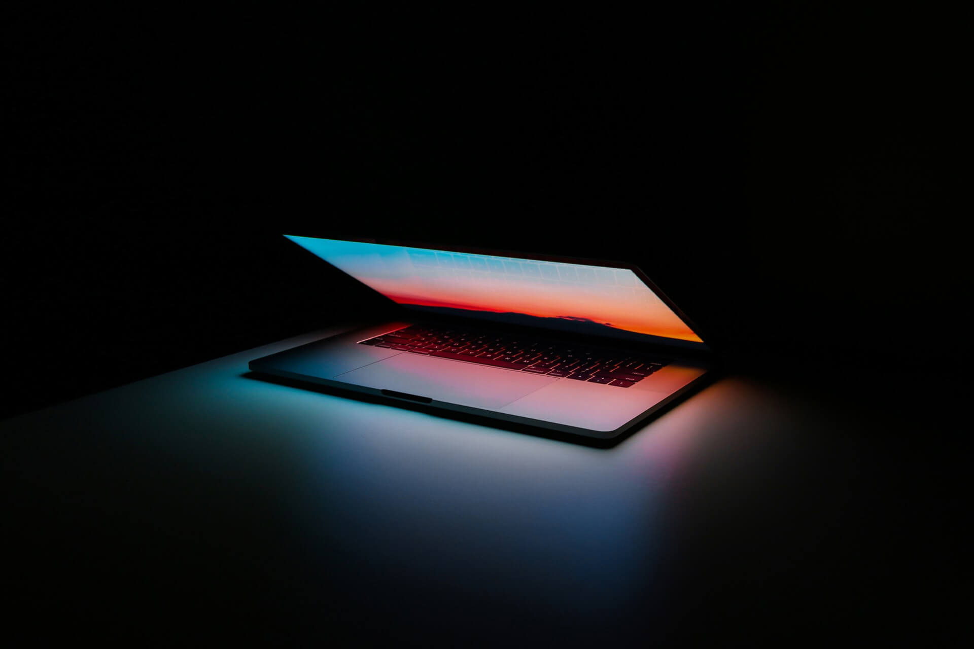 Laptop with lid open halfway.