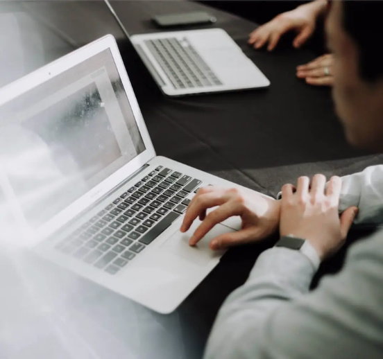 Two laptops on a desk.